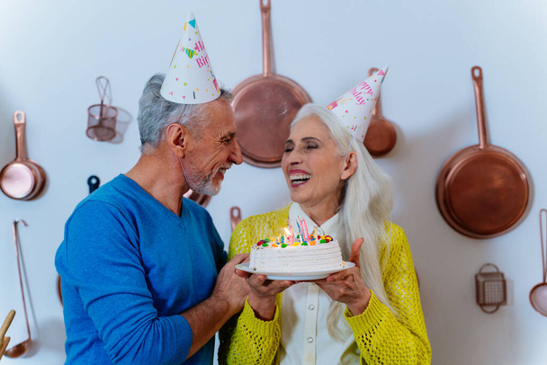 Happy senior couple lifestyle moments inside their beautiful countryside house - Fotografie, Obrázek