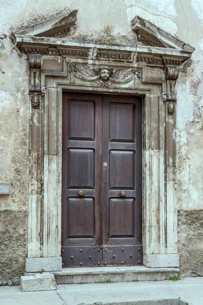 detail of marble monumental Reinassance portal, shot in bright light at Pescocostanzo, L'Aquila, Abruzzo, Italy - Fotó, kép
