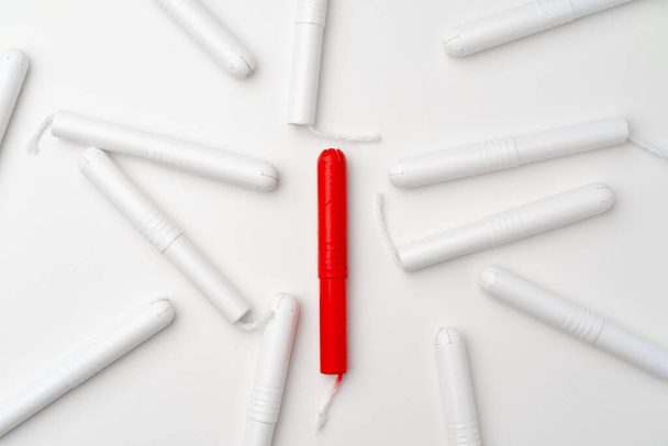 Red and white woman medical tampons on white background - Photo, Image
