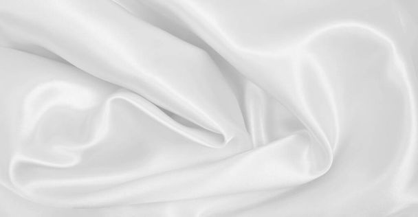 Smooth elegant white silk or satin luxury cloth texture can use as wedding background. Luxurious background design - Foto, afbeelding