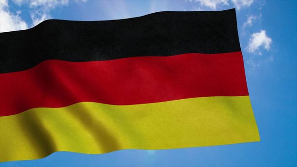 Flaga Niemiec macha na wietrze, niebieskie tło nieba. 3d renderowanie - Zdjęcie, obraz