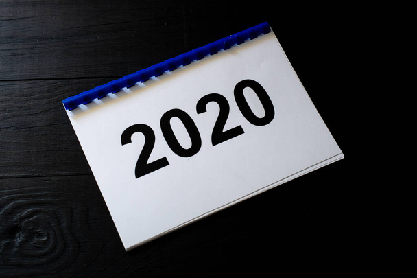 2020 numbers on paper on a black background. - Foto, Imagem
