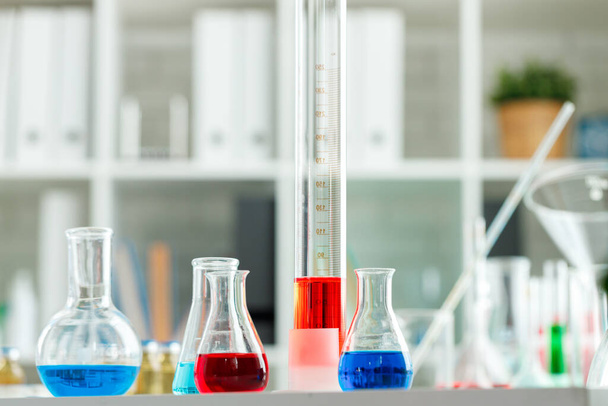 Laboratory glassware with color liquids close up - Foto, Imagem
