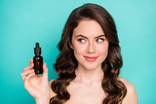 Closeup photo of beautiful naked lady wavy long hairdo hold professional cure serum bottle oil treatment cosmetologist specialist advising buy product isolated teal color background - Fotografie, Obrázek