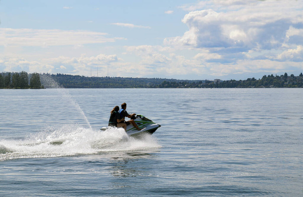 A pair of people are leaving the marina with a jet ski. Lake Washington, Kirkland.  - Fotografie, Obrázek