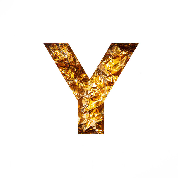 Gold letter Y of English alphabet of shiny foil and paper cut isolated on white. Festive golden typeface - Valokuva, kuva