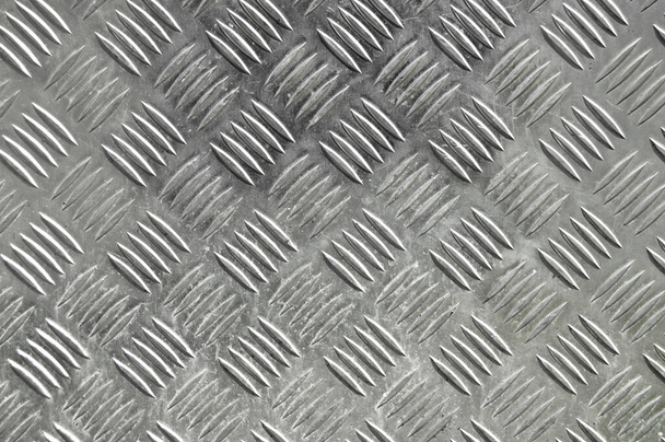 Struttura metallica della piastra del pavimento in acciaio inossidabile con motivo diamantato urtato, superficie della struttura metallica - Foto, immagini