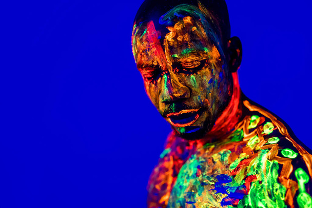 afro american man posing in studio shot with UV light - Fotoğraf, Görsel