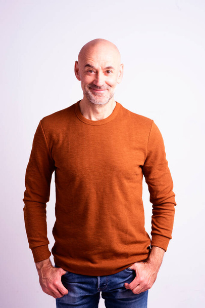 Portrait shot of happy senior man wearing casual clothes while standing at isolated white background. Copy space.  - Fotoğraf, Görsel