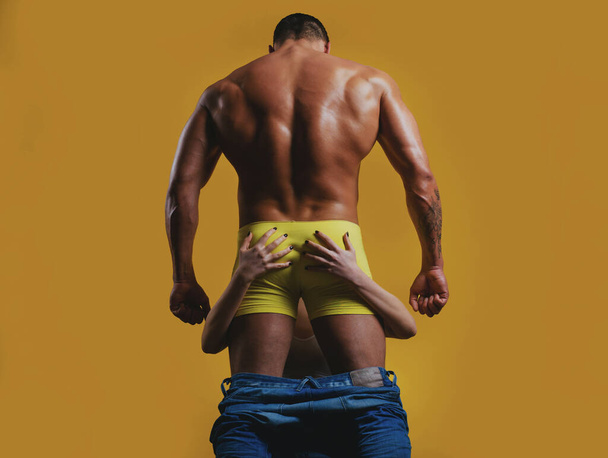 Sexy couple in love. Bare mans torso. Strong backside. Sensual passion lovers. Masculine bum. Strong man or muscular men. - Photo, Image