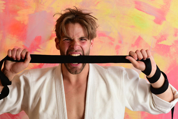 Healthy lifestyle and jujitsu concept. Man with wild face - Fotoğraf, Görsel