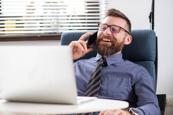 portrait of happy businessman speaking on phone - Photo, Image