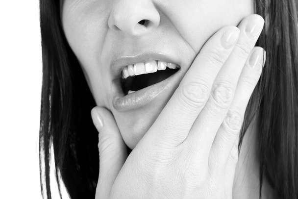 Woman with a toothpain, isolated on white - Foto, imagen