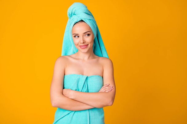Portrait of adorable pretty lady crossed arms look empty space turquoise towel isolated on yellow color background - Fotografie, Obrázek