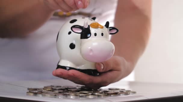 Piggy bank white bull. Christmas. 2021 new year. Year of the bull. Concept. Saving money as a way of life. Close-up - Footage, Video