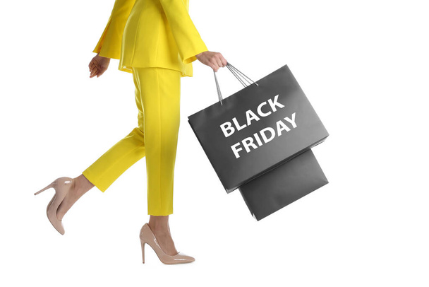 Woman with shopping bags on white background, closeup. Black Friday Sale - Foto, imagen