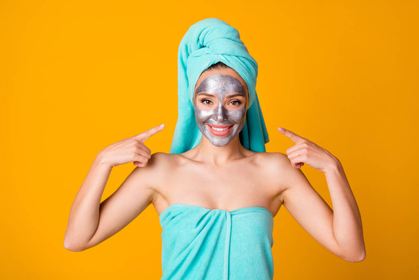 Photo of young cheerful woman show point herself enjoy facial spa treatment isolated over yellow color background - Valokuva, kuva