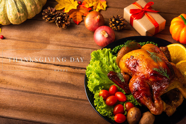 Thanksgiving roast turkey or chicken and vegetables, Top view Christmas dinner feast food decoration traditional homemade on wooden table background, Happy thanksgiving day of holiday concept - Φωτογραφία, εικόνα