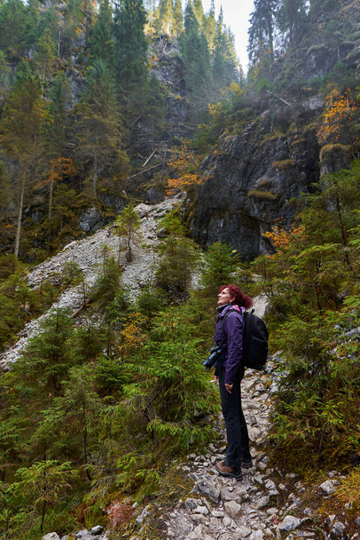 Tourist lady with camera hiking in the limestone mountains - Φωτογραφία, εικόνα