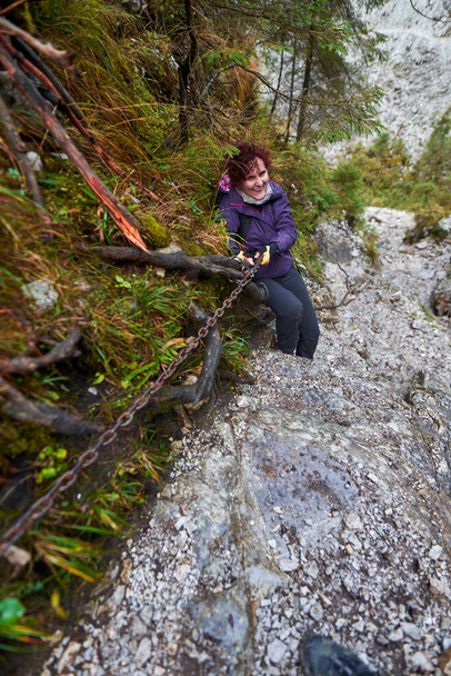 Tourist lady with camera hiking in the limestone mountains - Zdjęcie, obraz