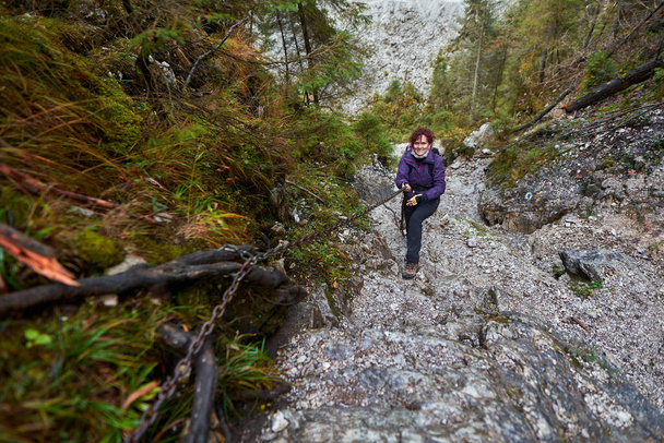 Tourist lady with camera hiking in the limestone mountains - Zdjęcie, obraz