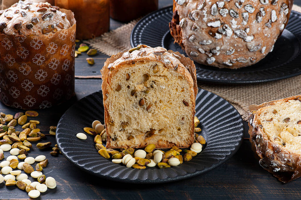 Delicious homemade panettone with natural fermentation. With white chocolate and pistachios - Photo, Image