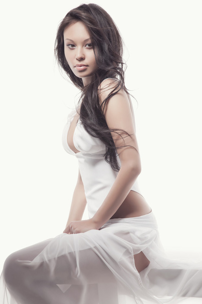 Gorgeous asian woman in white dress - 写真・画像