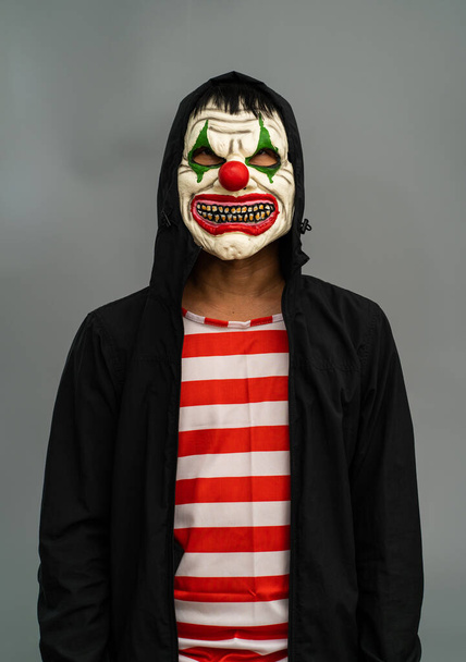 Halloween party costume. Joker makeup mask portrait. - Фото, зображення