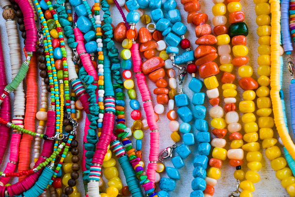 Colorful necklaces and bracelet mix, large group of beads and stone necklace, jewelry background - Photo, Image