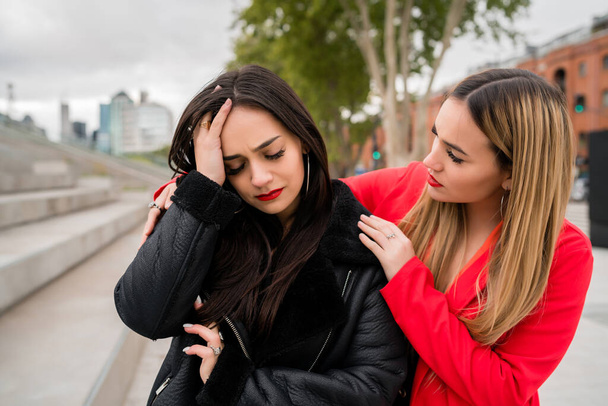 Young woman consoling and comforting her upset friend. - Photo, image