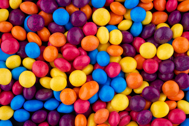 background of colorful caramel and chocolate toppings - Photo, Image
