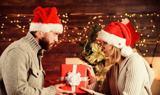 Lovely atmosphere. celebrate christmas together. winter season sales. happy new year. family holiday. couple in love santa hat. Time for presents. greeting time. woman and man love xmas gifts - Zdjęcie, obraz