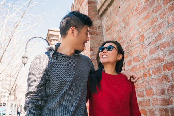 Asian couple walking in the city. - Fotografie, Obrázek