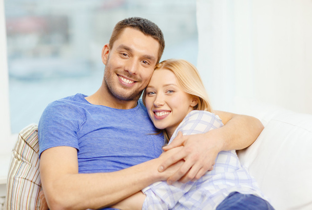 Smiling happy couple at home - Фото, изображение