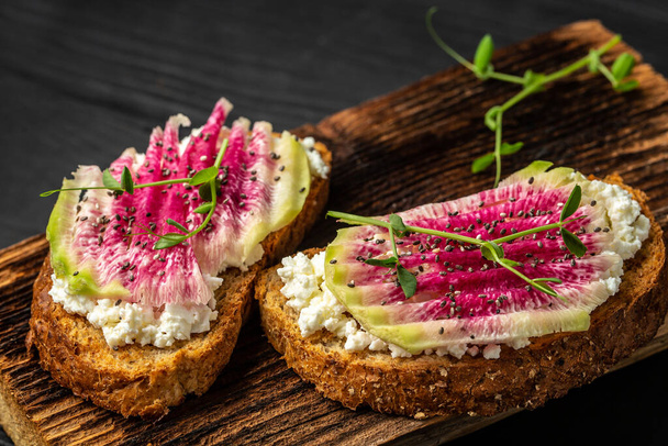 vegetarian Bruschetta with goat cheese, watermelon radish. banner, catering menu recipe place for text, top view. - Photo, Image