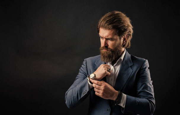 He in shirt with hand watch. stylish successful man in suit posing. business man wear suit. official office lifestyle. serious bearded man. handsome and successful man in expensive suit. copy space - Photo, Image