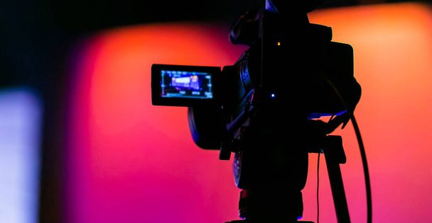 A video camera recording an illuminated stage - Foto, Imagem