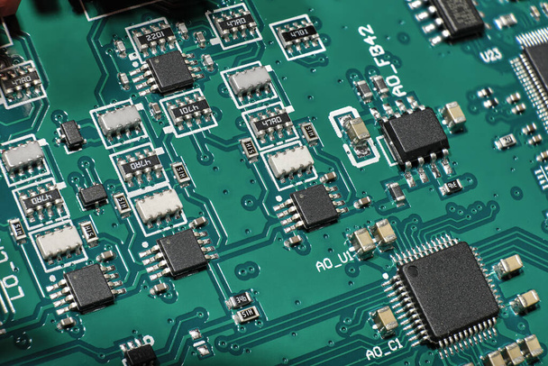 Closeup macro shot of green PCB. - Foto, afbeelding