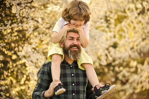 Happy family. Fatherhood happiness. Fathers day. Earth day. Little boy and father in nature background. Hipster and baby son. Happiness concept. Spring walk. Ecology and environment. Simple happiness - 写真・画像