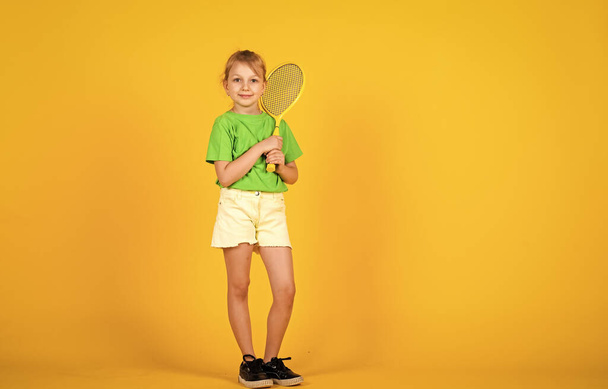 Tennis club for kids. Tennis player with racket. Childhood activity. Fitness brings health and energy. Gym workout of teen girl. Sport game success. Happy child play tennis. Tennis training - 写真・画像