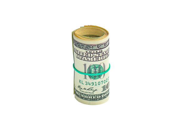 Roll of dollar bills tied with elastic band isolated on white background. - Photo, Image