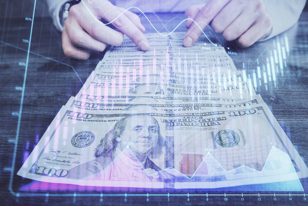 Multi exposure of forex graph drawing hologram and USA dollars bills and man hands. Technical Analysis concept. - Valokuva, kuva