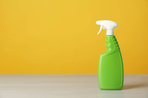 Bottle of cleaning product on light table. Space for text - Fotografie, Obrázek