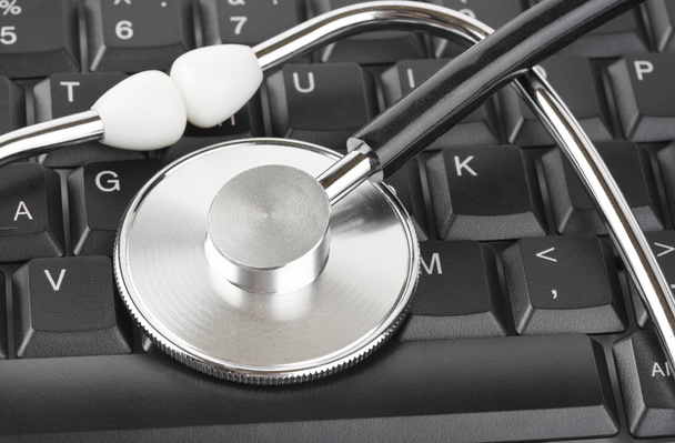 Stethoscope and computer keyboard - Photo, Image