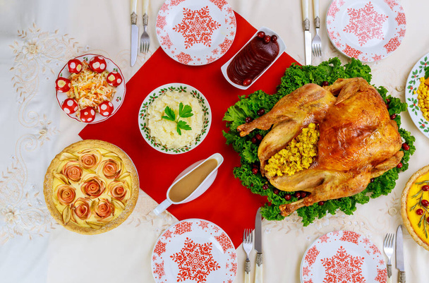 Christmas or New Year dinner with roasted turkey and traditional dishes. Top view. - Foto, imagen