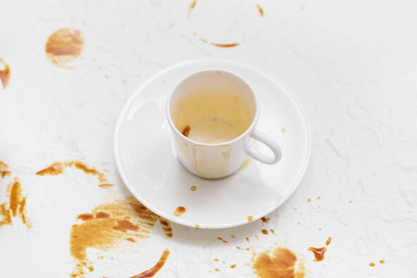 Cup and coffee stain on light background - Foto, immagini
