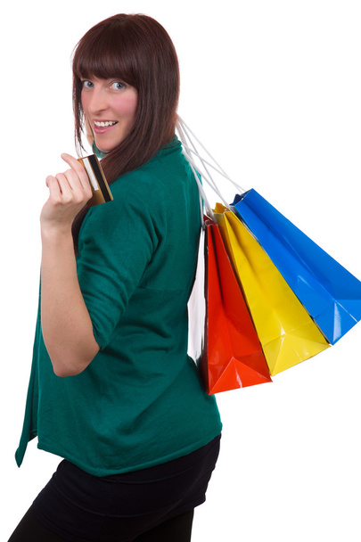 Smiling woman with credit card and shopping bags - Fotografie, Obrázek