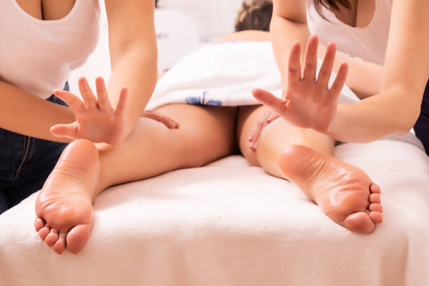 A closeup shot of professional masseuses giving a massage - 写真・画像