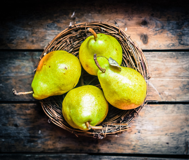 Pears on rustic wooden background - Фото, зображення