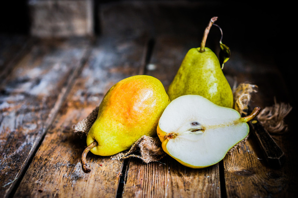 Pears on rustic wooden background - Фото, зображення
